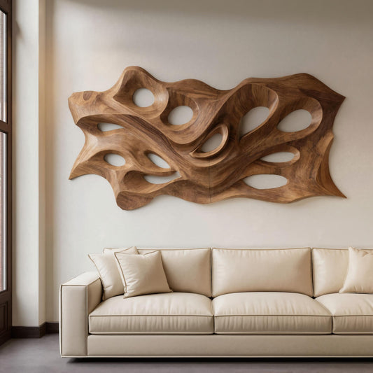 Beige sofa in a room with a large wooden wall sculpture
